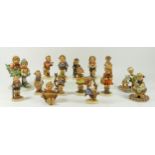 A collection of fifteen Hummel figurines to include Apple tree boy and Apple tree girl. Year shown
