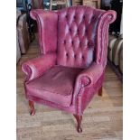 A Queen Anne style burgundy leather button back wing armchair, 80 x 80 x 108cm.