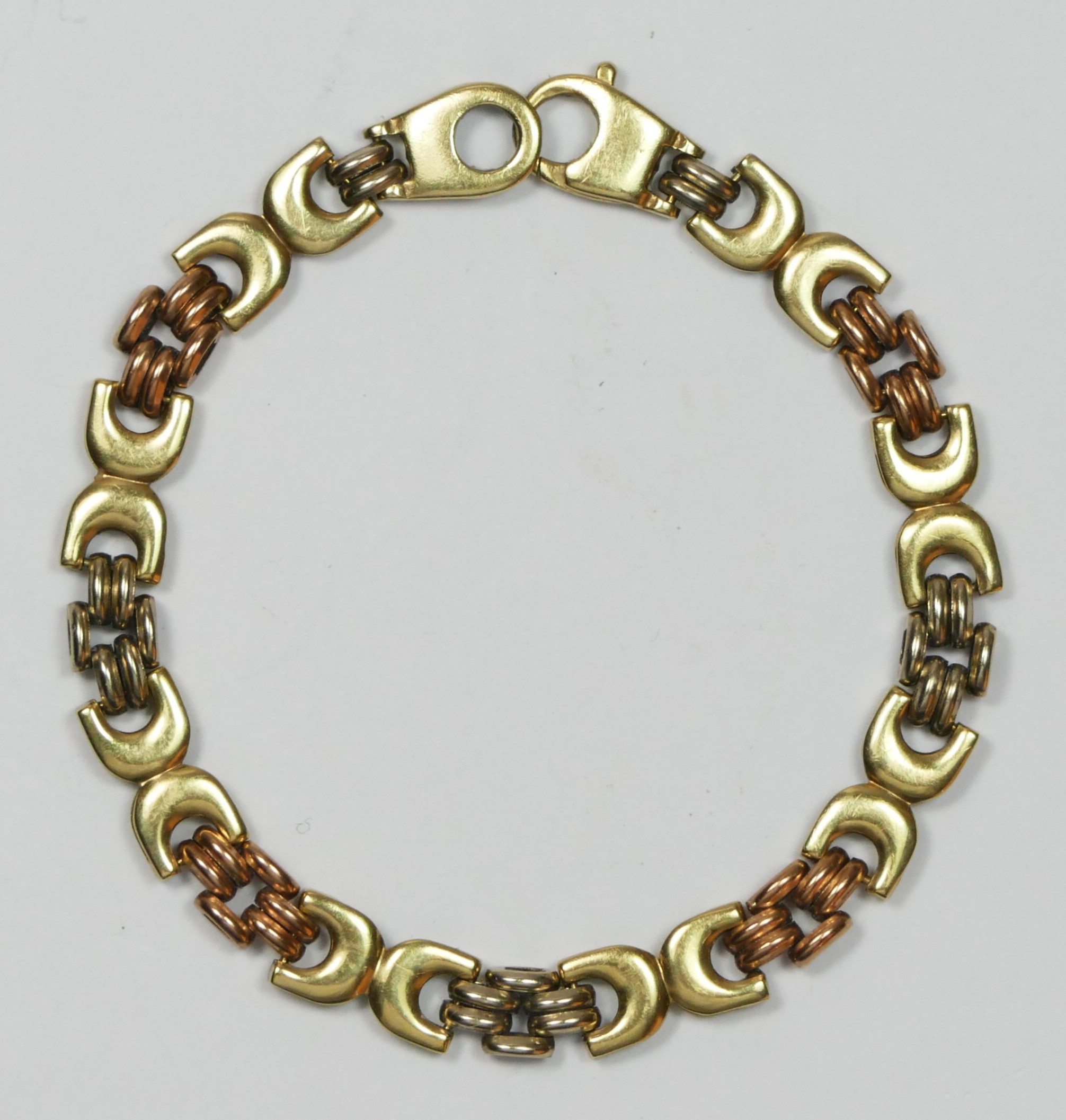 A 9ct three colour gold bracelet, 18cm, 10.7gm
