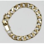 A 9ct gold flattened curb link bracelet, 31.3gm