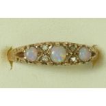 A Victorian style 9ct gold three stone opal ring, diamond points between, M, 2.1gm