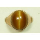 A 9ct gold and cabochon tigers eye signet ring, 14 x 10mm, L, 4.7gm