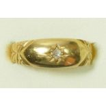 An 18ct gold and star gypsy set diamond ring, L 1/2, 2.2gm