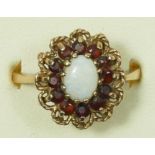 A 9ct gold garnet and opal cluster ring, O, 3.2gm