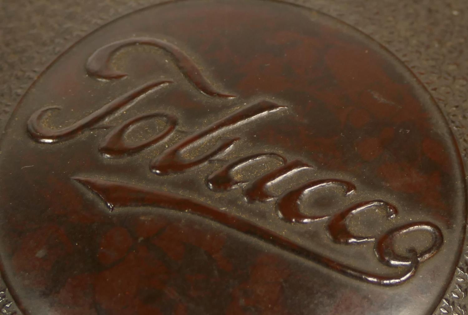 A Bakelite tobacco jar, with embossed leaf decoration, 11cm and an embossed brass example with - Image 2 of 2