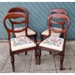 A set of four Victorian mahogany balloon back chairs with drop in seats.