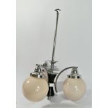 An Art Deco period 3 branch chandelier, chrome with pink globe opaque glass shades. (re-wired to