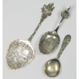 A Dutch silver cast ship spoon, an embossed spoon, London import marks 1900 and an 800 standard