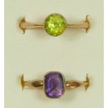 An Edwardian 9ct rose gold and amethyst ring, K 1/2 and an unmarked gold peridot ring, K, 3.9gm