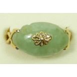A 14K gold and carved cabochon jade dress ring, 16 x 10mm, P, 3.2gm