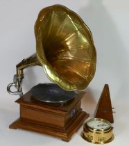 A reproduction His Masters Voice gramophone, together with a metronome and a Talamex ships bulk head