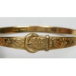 A 9ct gold hinged bangle with Celtic motif, 9.4gm