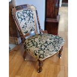 A Victorian Aesthetic Movement mahogany nursing chair, with inlaid ebony and boxwood decoration,