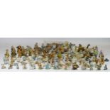 Over 100 miniature Wade figures and other small cabinet pieces (mainly figural), including Tom and