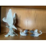 Lladro Turtle Dove, 28cm, with a pair of Lladro fluttering cranes numbered 1598 and 1599, 8cm. (3)