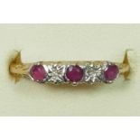 A 9ct gold ruby and diamond ring, O, 1.4gm