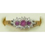 A 9ct gold ruby and diamond dress ring, Q, 1.6gm