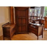 An oak hall robe with linen fold panel door, 96 x 38 x 184cm, an oak dressing table with matching