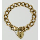 A 9ct gold solid curb link bracelet, heart padlock, 37.8gm