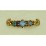 A Victorian unmarked gold opal and garnet ring, scroll shoulders, S 1/2, 1.7gm
