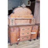 A Victorian waxed pine chiffonier with shaped backboard with two banks of three drawers, three