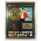 A mounted gold vinyl, Elvis Presley, One Night and I Got Stung, commemorating One Night being the