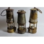 Two Eccles Safety Lamps, one a 6RS, stamped 76, another a SL stamped 160, together with a