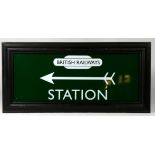 Framed green and white British Railways 'Station' sign with left pointing arrow.