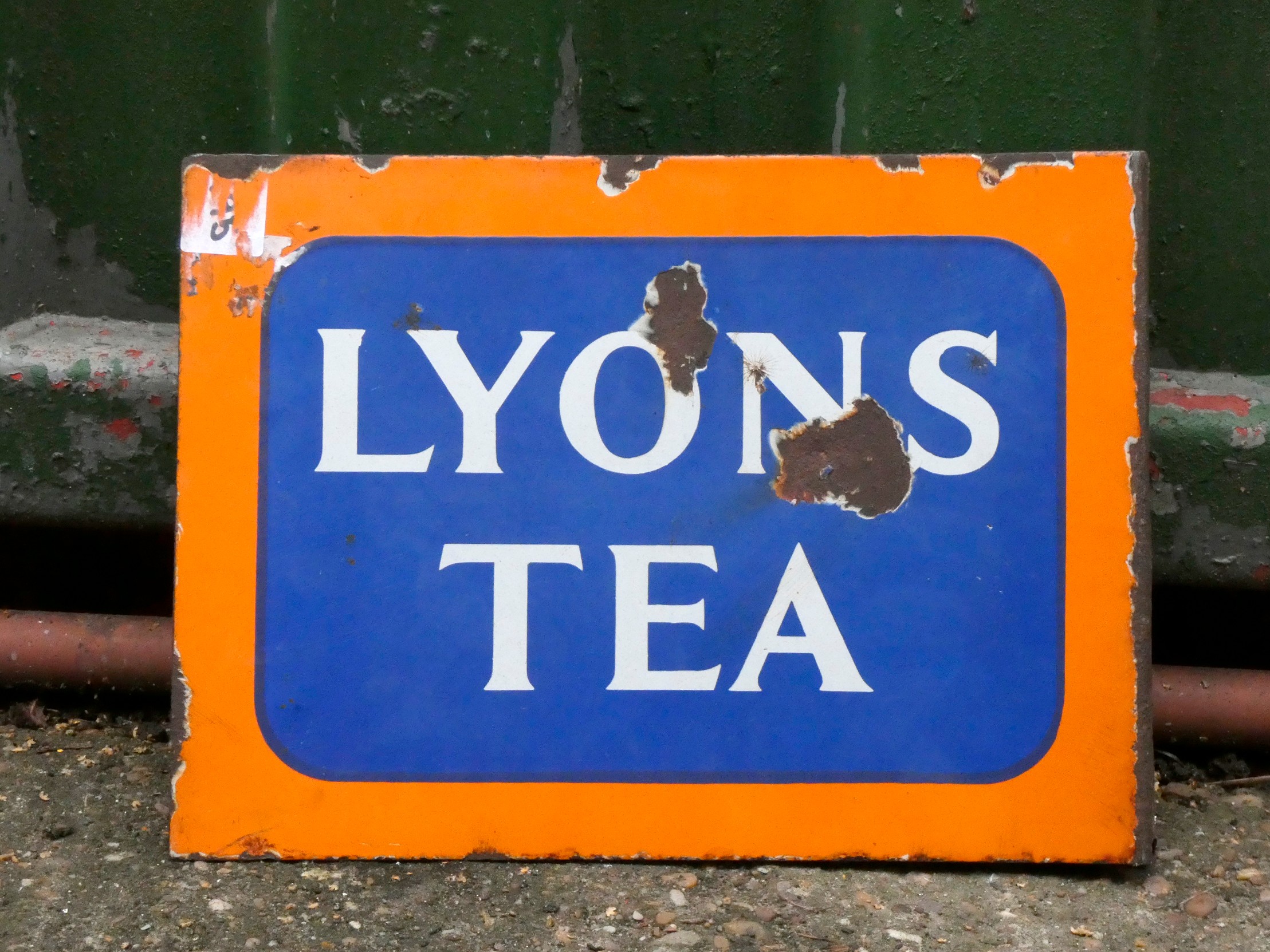 An enamel double sided sign, Lyons Tea, 39cm x 28cm