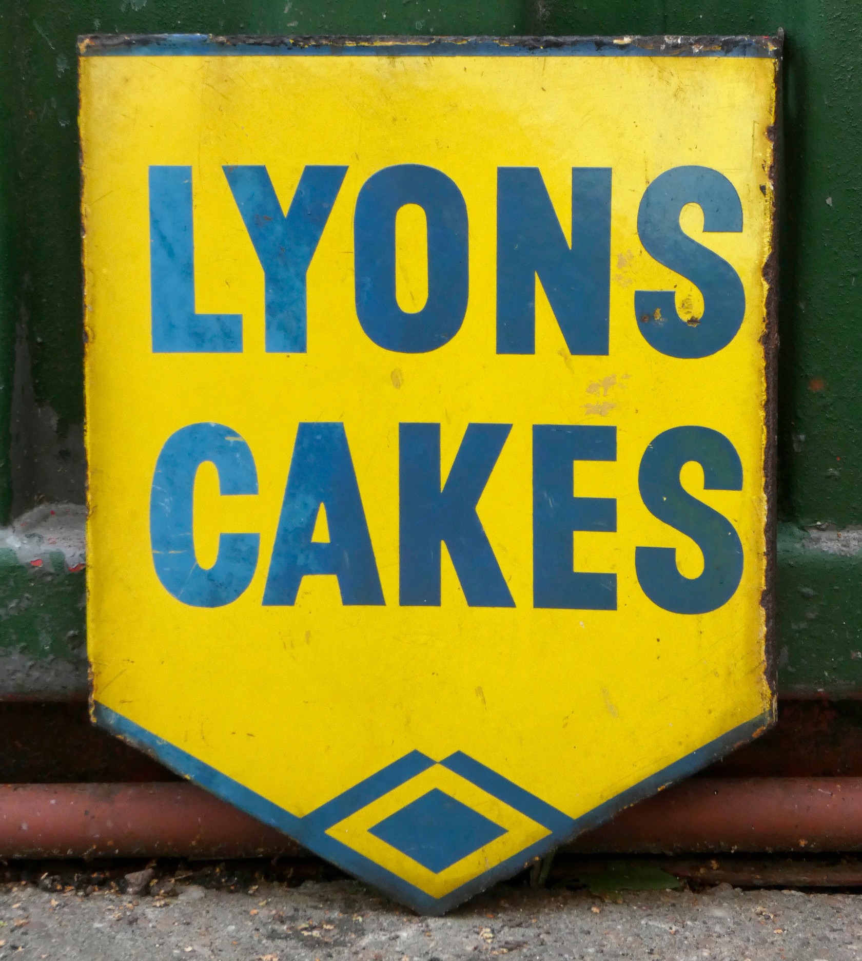 Lyons Cakes, a double sided wall mounted vitreous enamel advertising sign, 40 x 30cm.