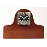 A WWII German 8 day aircraft clock by Kienzle, black dial with luminous Arabic numerals and hands,