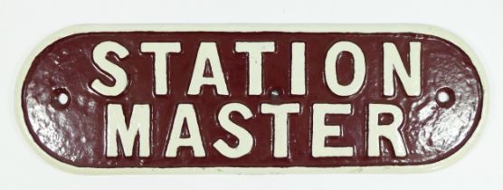 A reproduction cast metal sign, Station master, painted maroon and cream, 36cm x 11cm