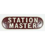 A reproduction cast metal sign, Station master, painted maroon and cream, 36cm x 11cm