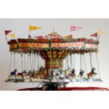 A Meccano shop display, 24 horse carousel, balanced on an electric motor including lights (not