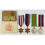 WWII a group of four, 1939-45 Star, France and Germany Star, Defense and War, papers and boxed