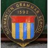 An enamel sign, Normanton Grammar School, depicting school crest and date, 40cm diameter