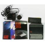 A Sinclair ZX81, AV and power cables, keyboard, manual, Basic programming book and software