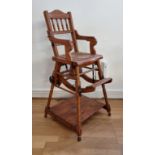 An Edwardian beech child's metamorphic high chair, converting to a rocking chair or a desk with