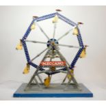 A Meccano shop display, Ferris Wheel, illuminated, powered, on a wooden base, 50cm x 62cm x 38cm