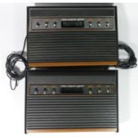 WITHDRAWN An Atari 2600 "woody", model CX-2600 U (serial No 548552075), together with another Atari