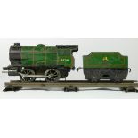 A Hornby clockwork / wind up O gauge loco and tender, 45746 in BR green livery, together with a