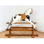 An early 20th century Lines Brothers "Sportyboy" Rocking Horse, stamped "LB Ltd SP1" on turned
