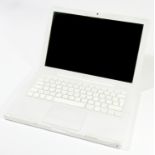 A 2007 Macbook, 13 inch screen, white, no charger, serial number W87220WFYA2