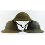 A WWII British Army Brodie helmet, dated 1941 and two WWII Zuckerman helmets, one dated 1941 (3).