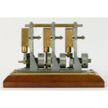 A Unit Steam Engine (USE) three cylinder model, 16 x 7 x 11cm.