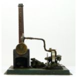 A Doll et Cie vintage tinplate live steam horizontal engine, 24 x 21cm. Doll et Cie (DC), were