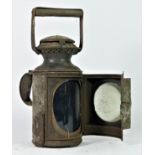 An L.M.S three aspect hand lamp, complete with burner, 32cm tall