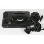 A Sega Mega Drive (serial No. 110084379), together with two controllers