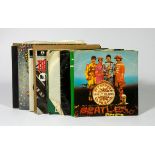 Twelve Beatles vinyl singles, to include Magic Mystery Tour (2 x 7" vinyl and book), All My