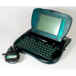 An Apple Newton eMate 300 laptop, with pen and original charger